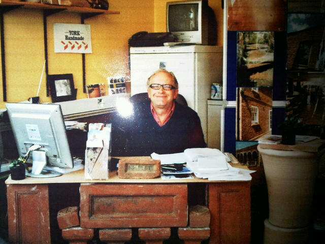 Terracotta Balustrading desk with Tim Bristow behind